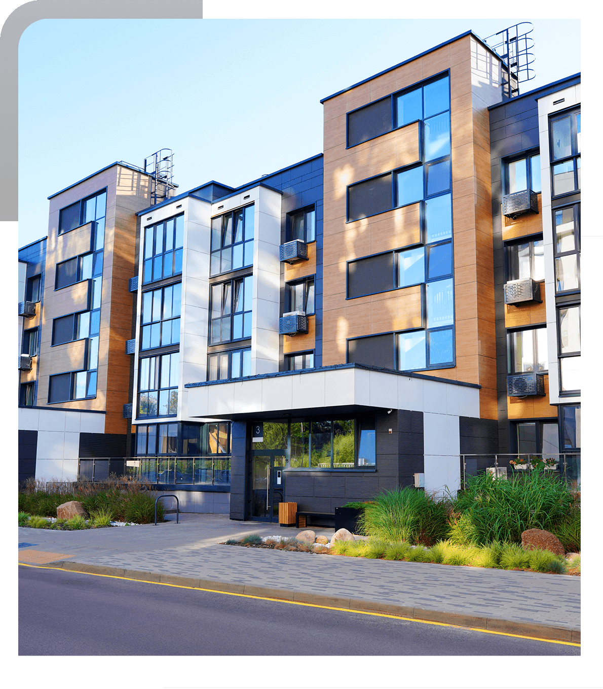 Modern apartment building with large windows.